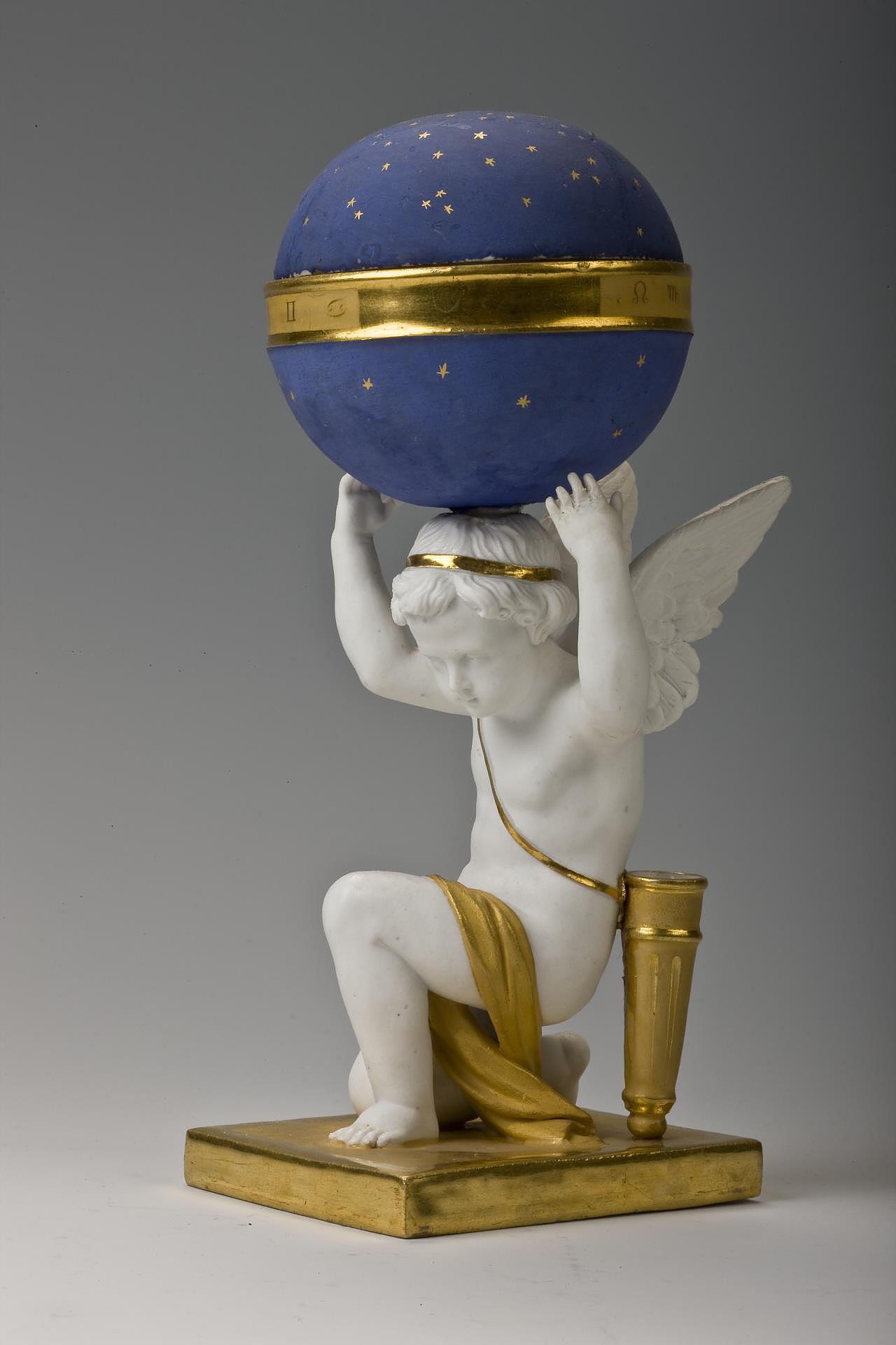 Inlaid Cupid with celestial sphere, porcelain, glaze frosted, gilding
